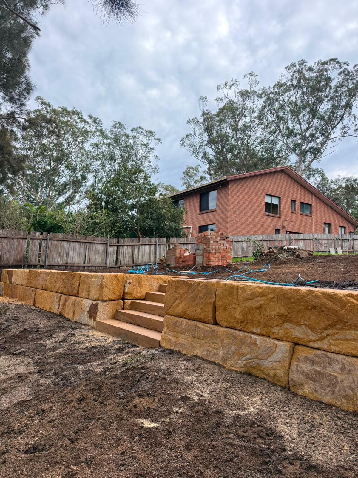 Sandstone blocks and sawn steps stacked and ready to be laid
